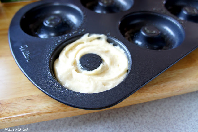 Raw donut dough in a donut pan