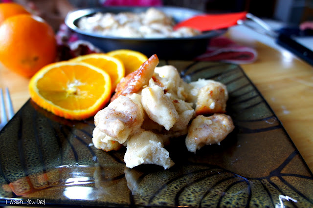 Orange Cinnamon Pull Aparts on a plate with a side of sliced oranges