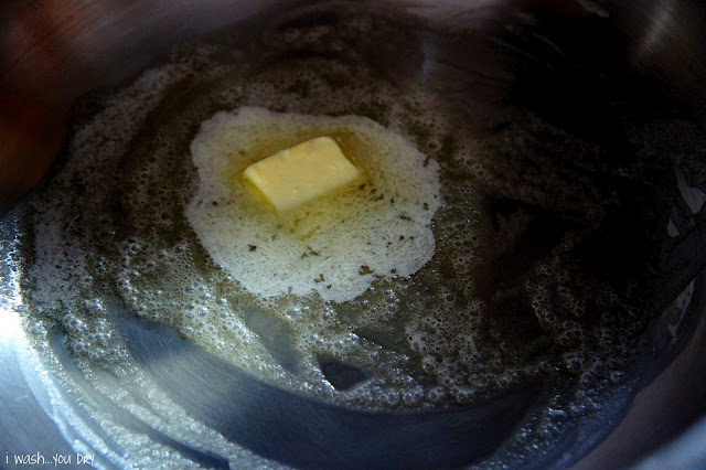 Melting butter in a pan.