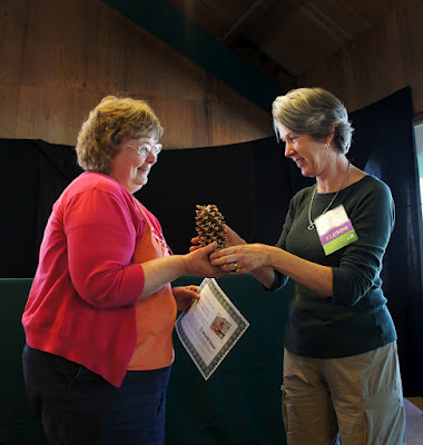 Mimi from Mimi Avocado being presented the Golden Pine Cone Award at Camp Blogaway 2012