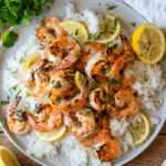 This Grilled Lemon Cilantro Shrimp Recipe is perfectly seasoned shrimp that are grilled up in minutes for a light and fresh Summer dinner.