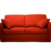 A orange loveseat. 