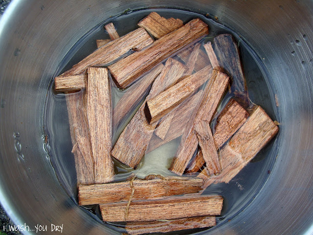 A pot with mesquite sticks soaking in water. 