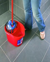 A mop in a bucket.