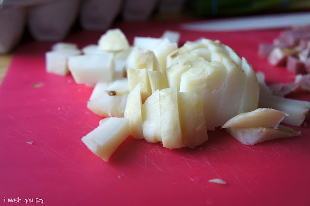 Chopped potatoes on a cutting board.