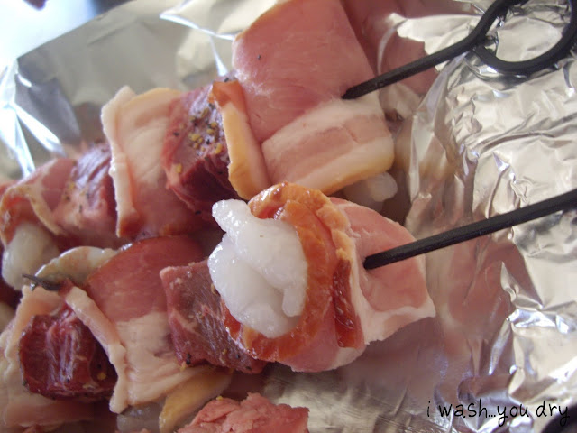 Raw bacon and meat on skewers. 