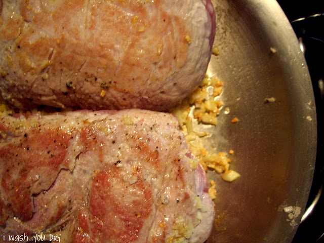 Pork cooking in a pan.