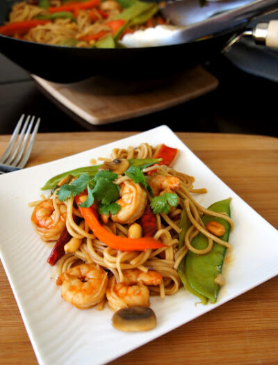 Kung Pao Shrimp Lo Mein displayed on a square plate