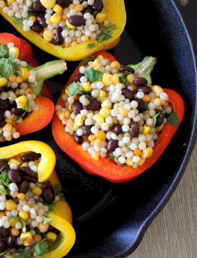 A close up of a pan filled with Couscous Stuffed Peppers