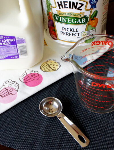 A display of ingredients needed to make buttermilk substitute using milk and vinegar