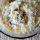 A close up of a bowl of mashed potatoes