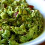 A close up of a bowl of guacamole.