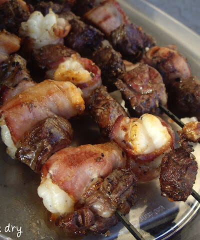 Cooked meat on skewers.