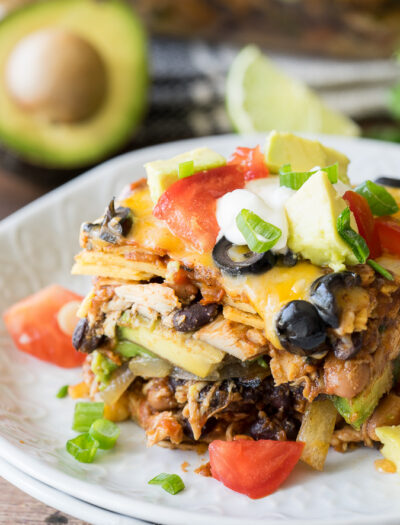 This super EASY Chicken Enchilada Casserole Recipe is a long time family favorite! It combines great flavors into a no-fuss dinner!