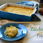 A scoop of casserole on a plate in front of a pan of Cheesy Zucchini and Potato Casserole