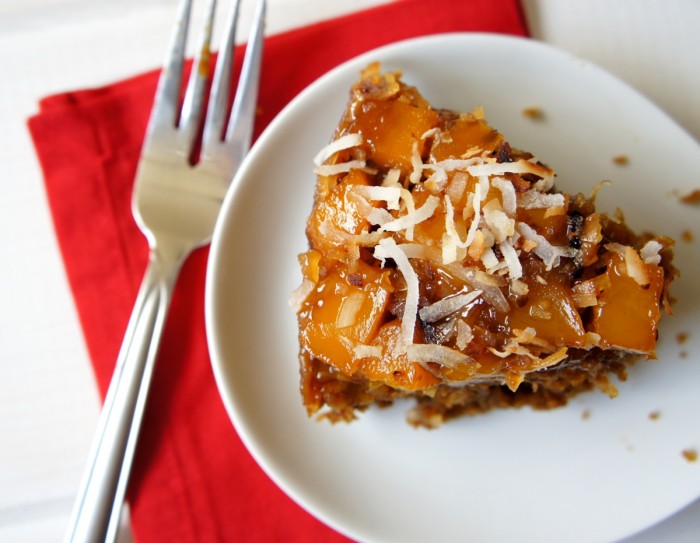 A slice of Mango Upside Down Gingerbread Cake  on a white plate