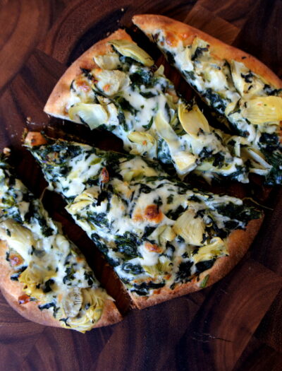 Sliced flat bread pizza on a table