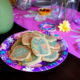 A plate of sugar cookies on a party plate