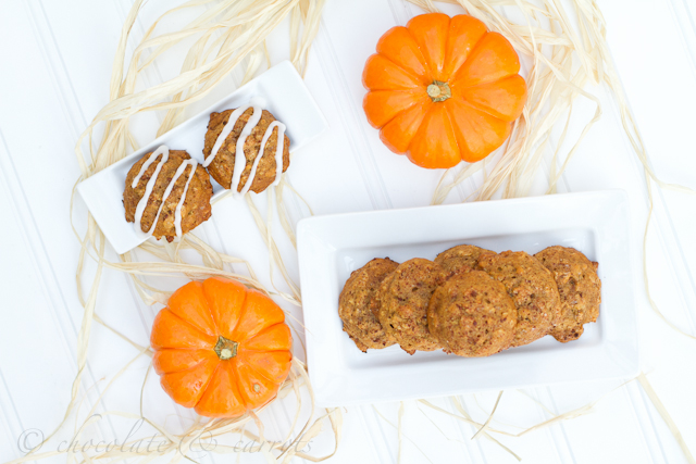 A look down of Pumpkin Oatmeal Cookies on a plate next to mini pumpkins