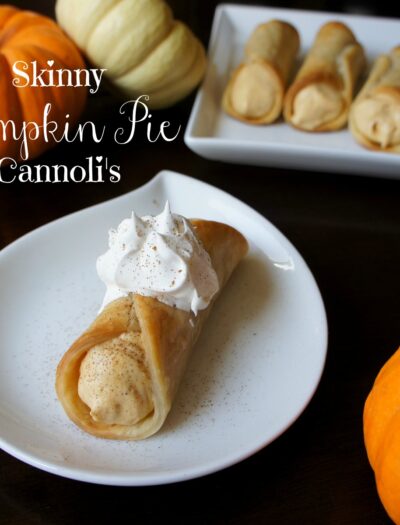 A plate displaying a Skinny Pumpkin Pie Cannoli in front of a larger platter with more cannolis