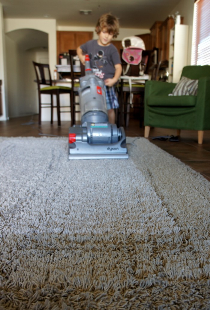 A child vacuuming 