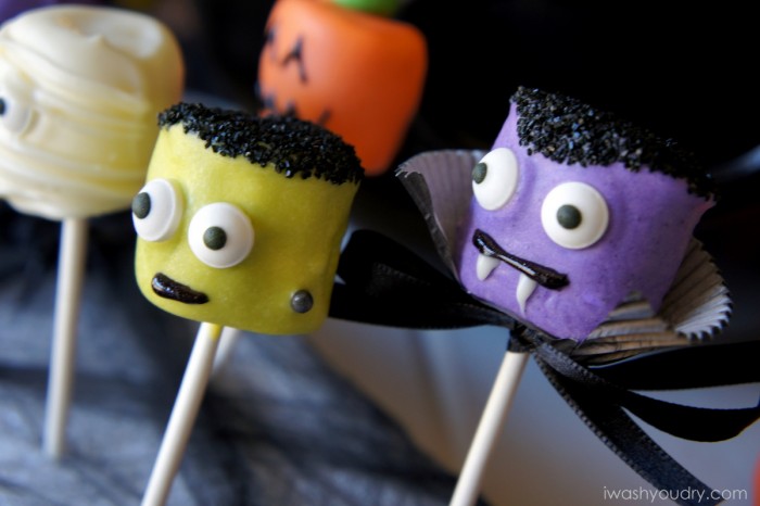 A close up view of Halloween themed Marshmallow pops -Frankenstein and a vampire