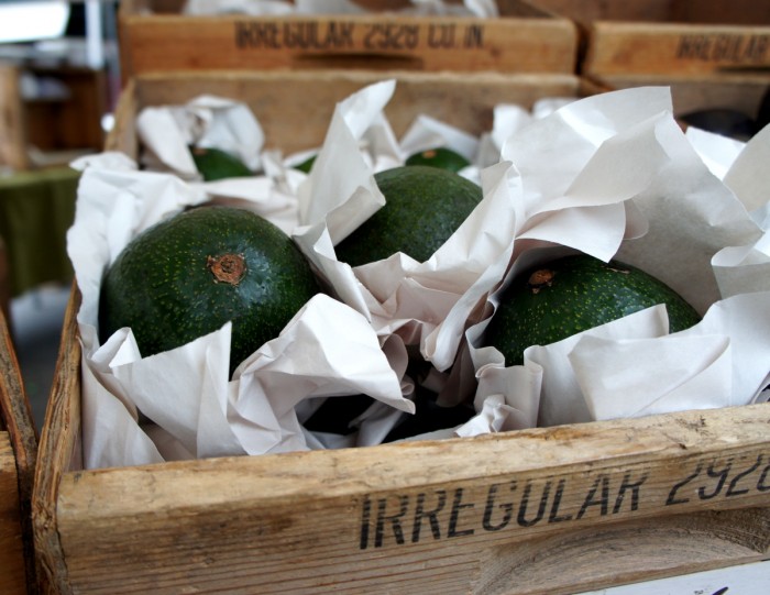 Avocados in a wooden box