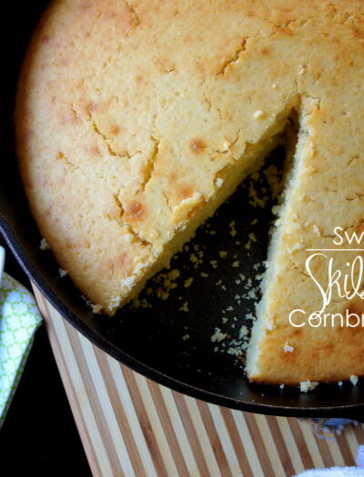 A close up of a pan of Sweet Skillet Cornbread with a slice removed