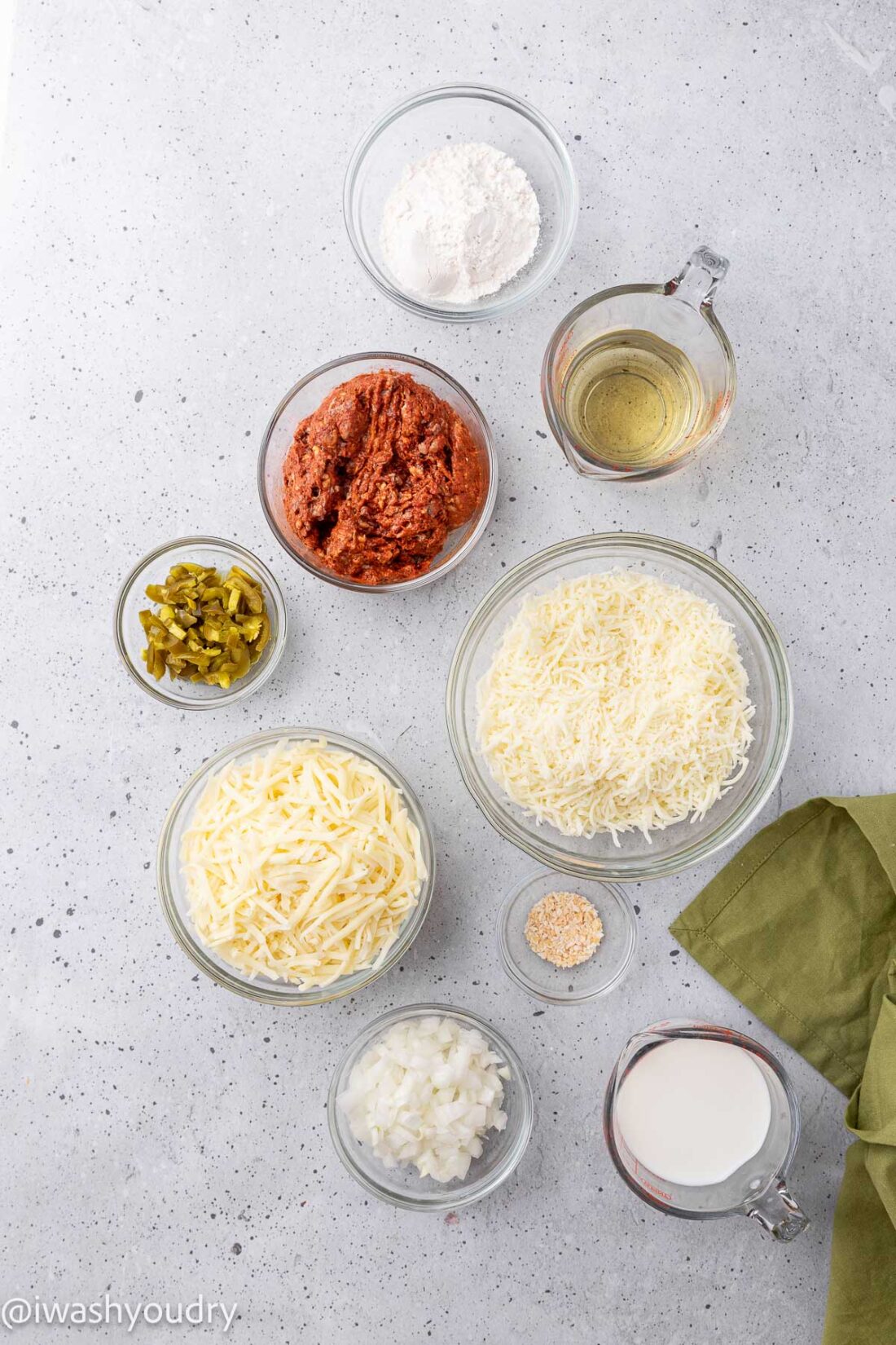 Ingredients for queso fundido in glass bowls. 