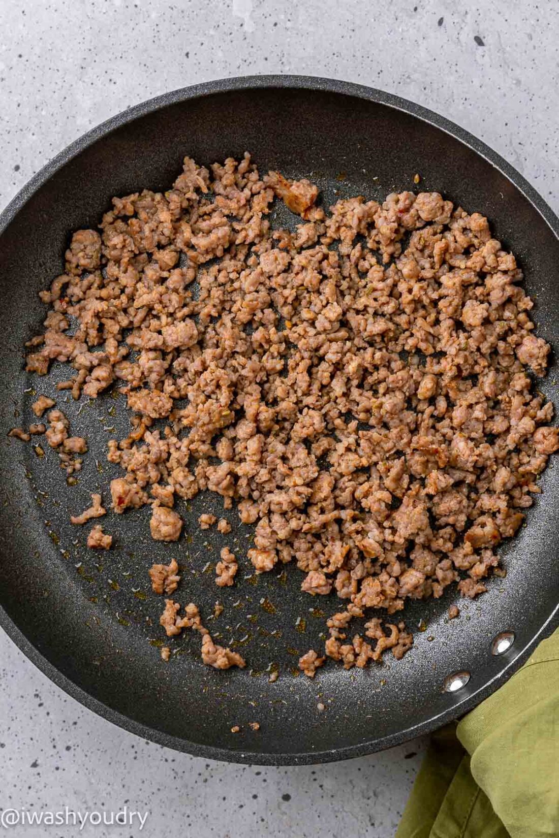 Cooked chorizo sausage in black pan. 