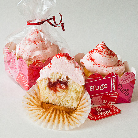 A display of Strawberry filled cupcakes with Laughy Taffy Frosting 