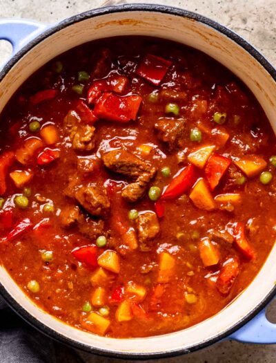 Cooked beef curry stew in ceramic pot.