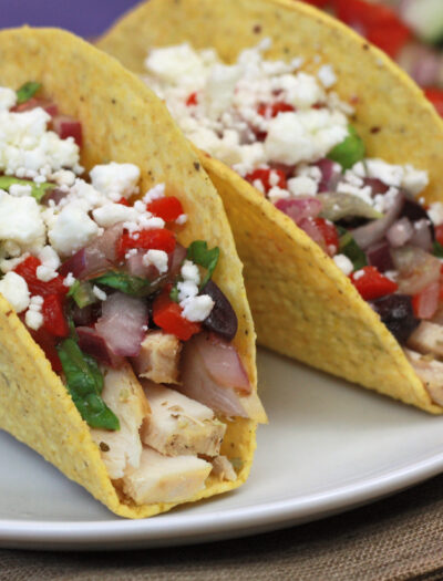 Close up of two tacos on a plate