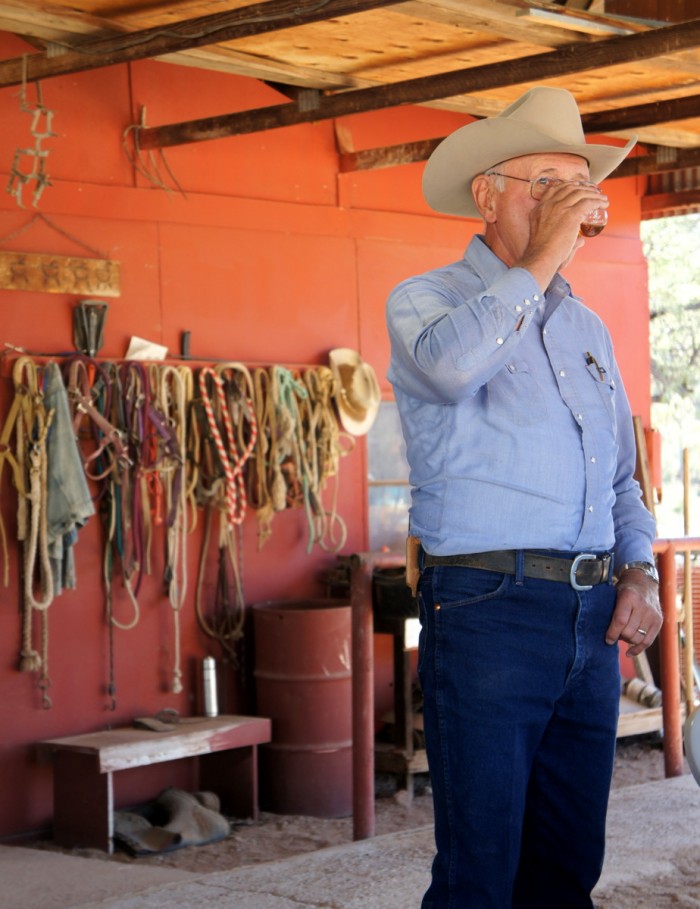 A rancher drinking a beverage