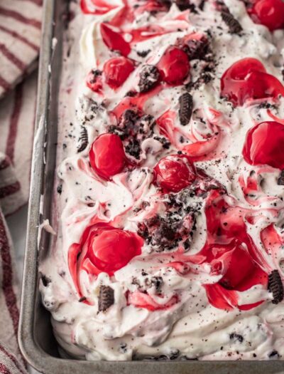 Chocolate cherry cheesecake ice cream in metal pan.