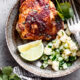 Cooked chickli lime chicken thighs on plate with pineapple cucumber salsa.