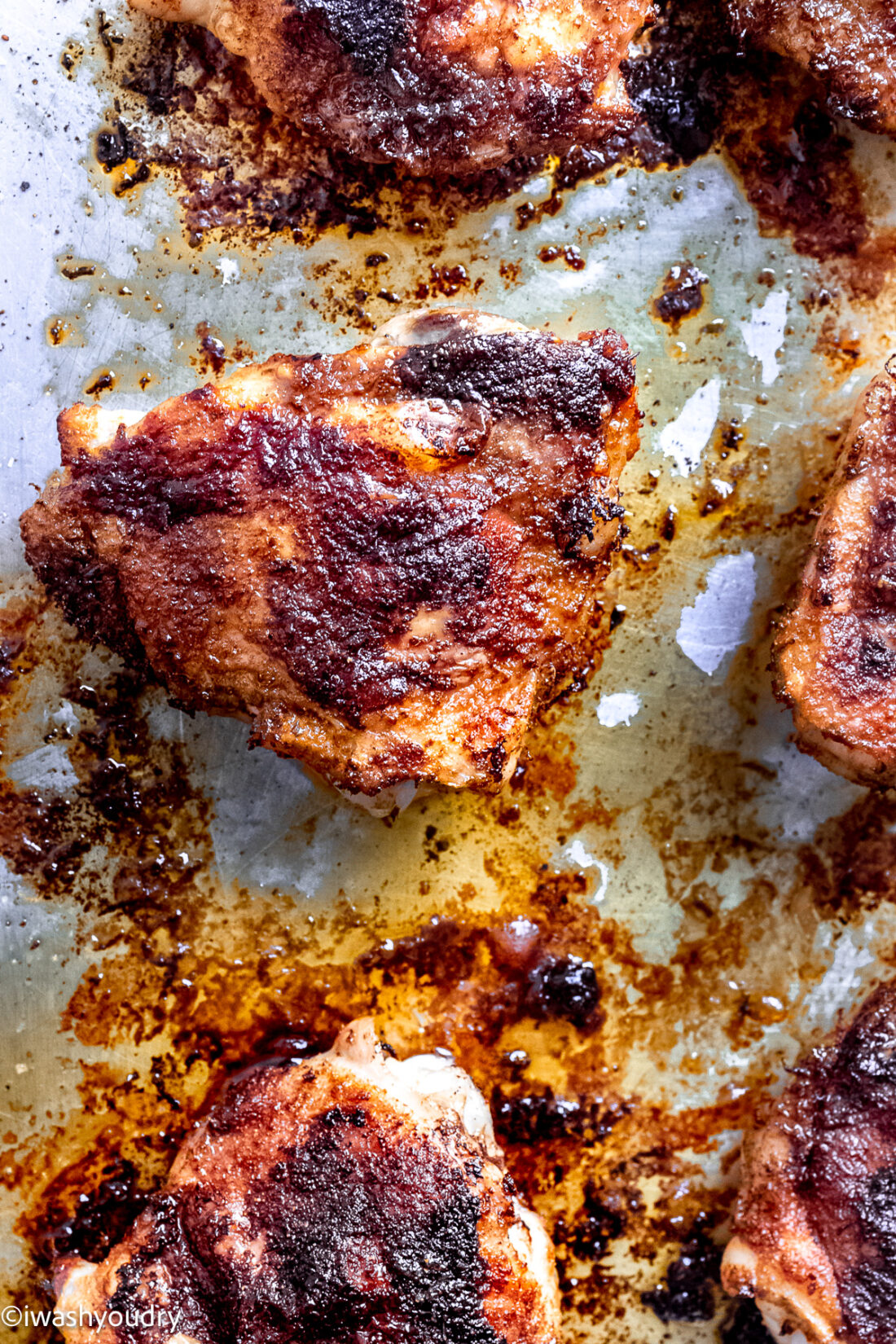 Cooked chili lime chicken on metal baking pan. 