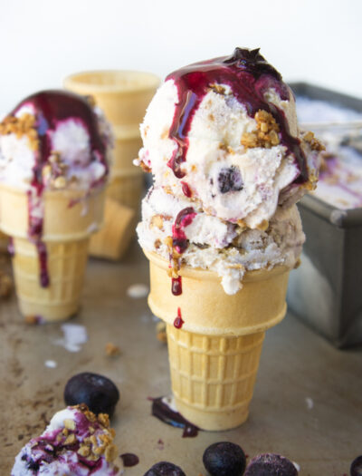 scoops of blueberry ice cream in cones.