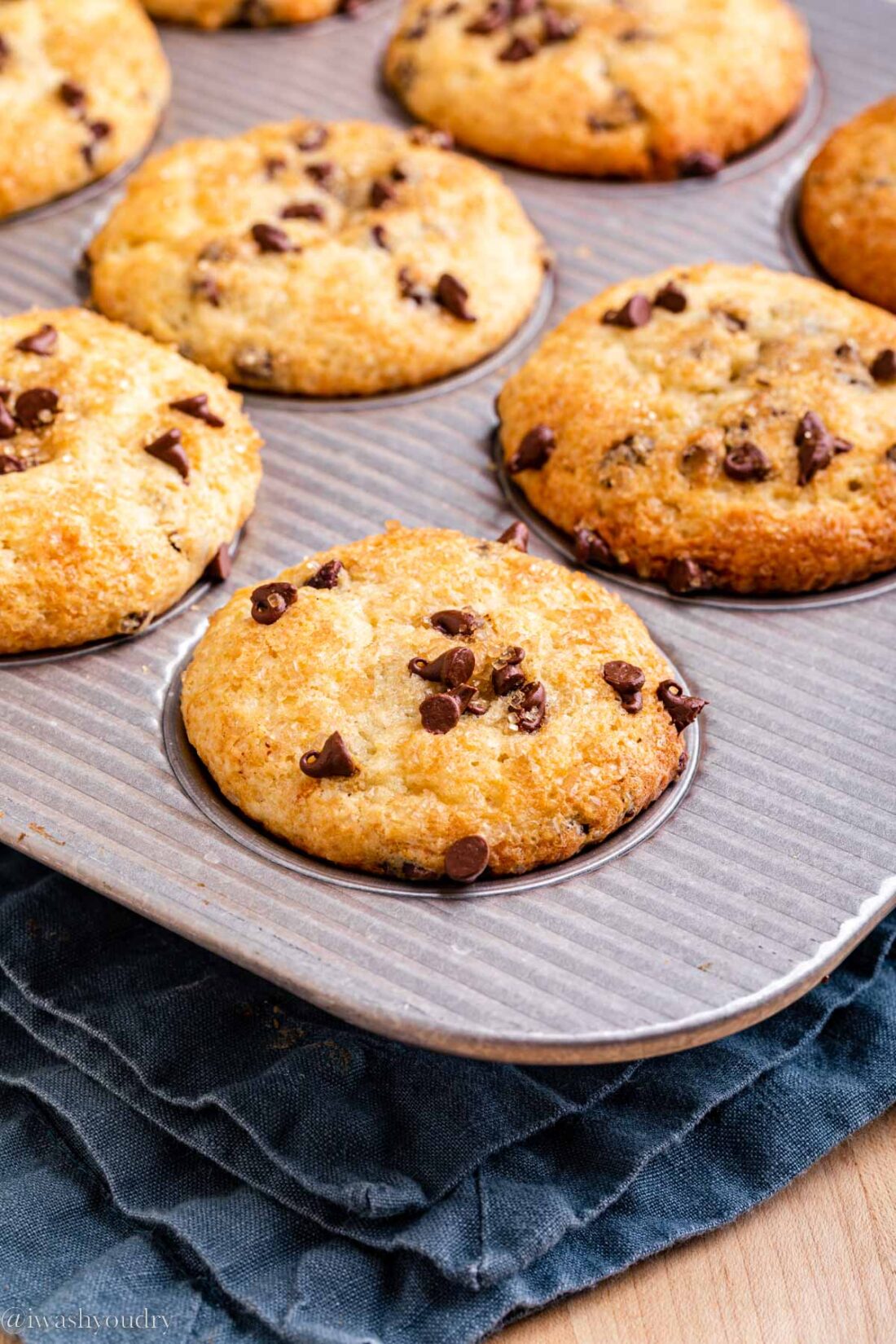 Baked nutella chocolate chip muffins in a metal pan. 