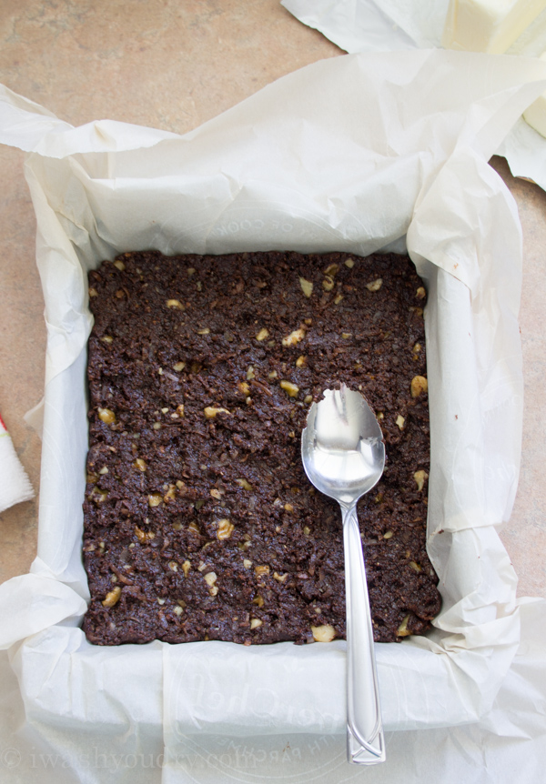 chocolate crust in pan with parchment paper