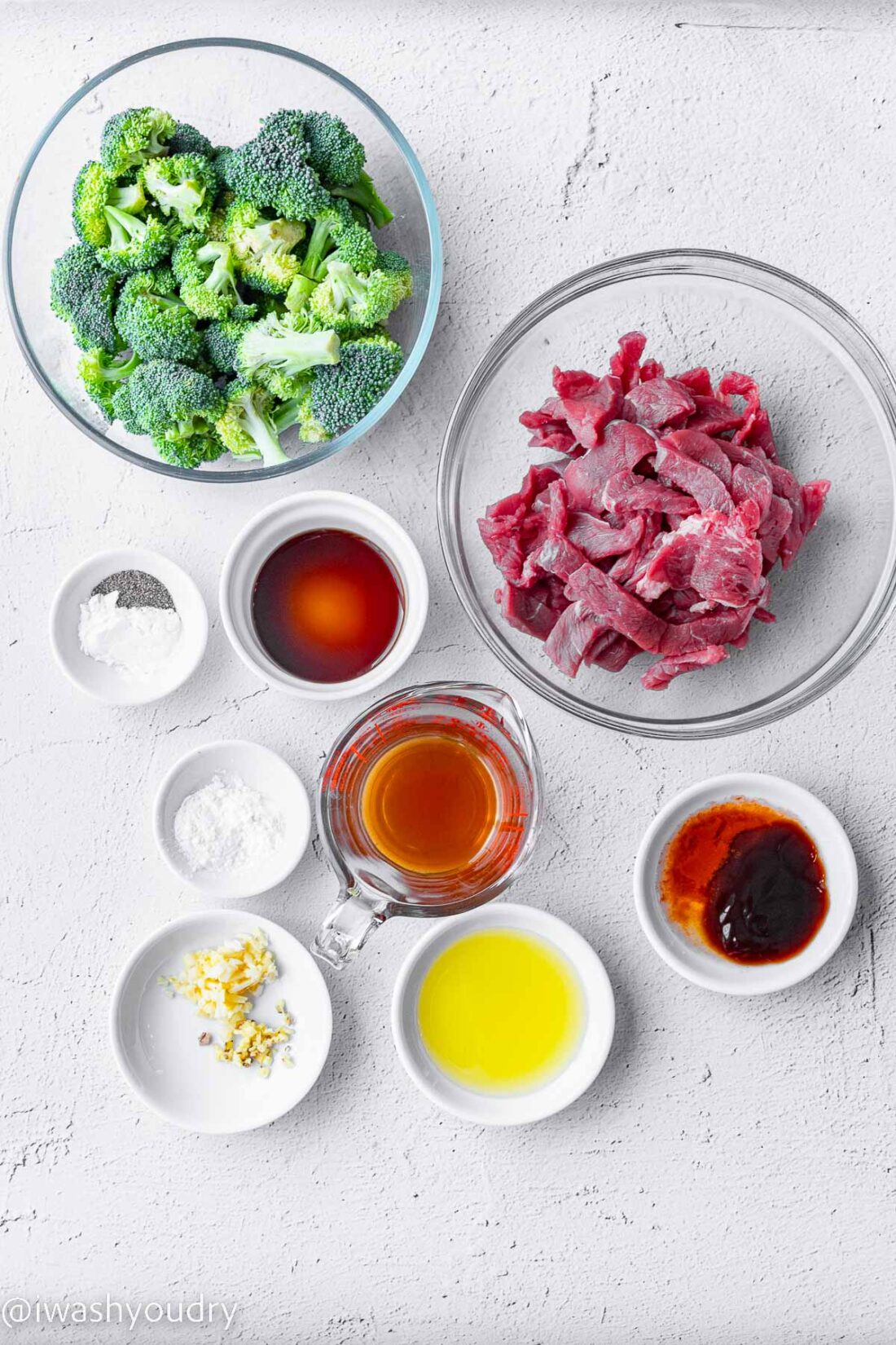 ingredients for Beef and Broccoli recipe on white surface