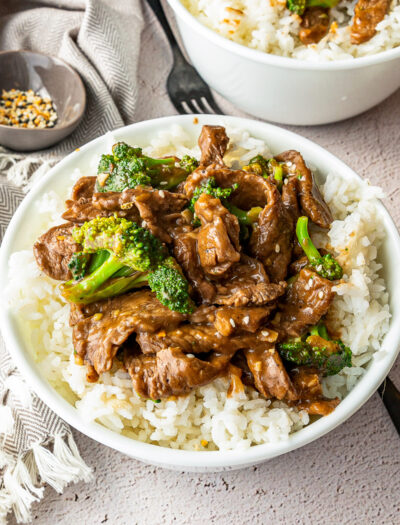 white bowl with rice and beef and broccoli sauce