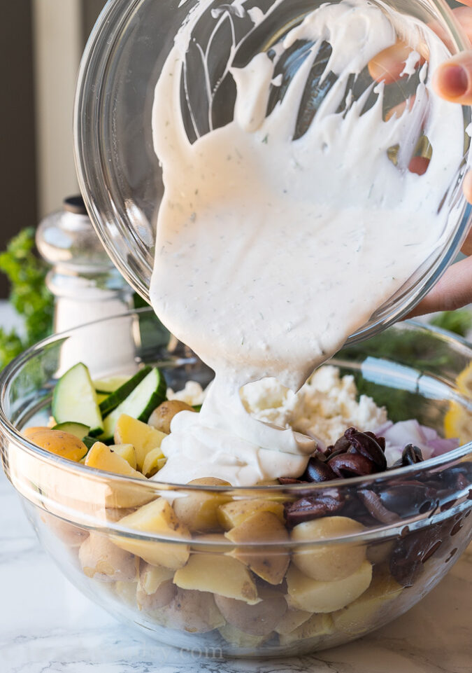 Pour the creamy dill potato salad sauce over the filling and toss to combine.