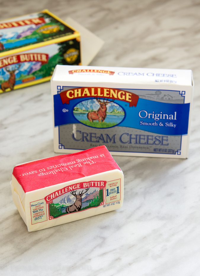 ingredients for alfredo sauce on white surface.