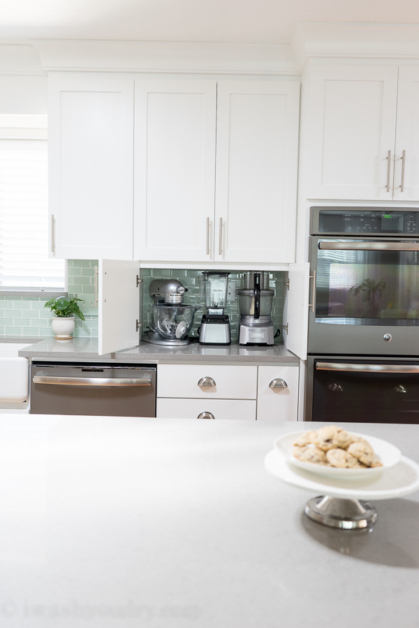 Secret storage of small appliances on counter top without all the clutter showing! Brilliant! 