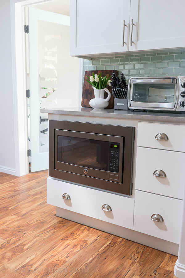 Under counter microwave, perfect for kid's use, with a drawer stashed full of snacks for the kids! 