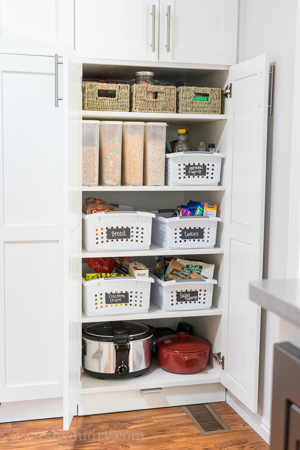 Baskets with chalkboard tape for easy pantry organization