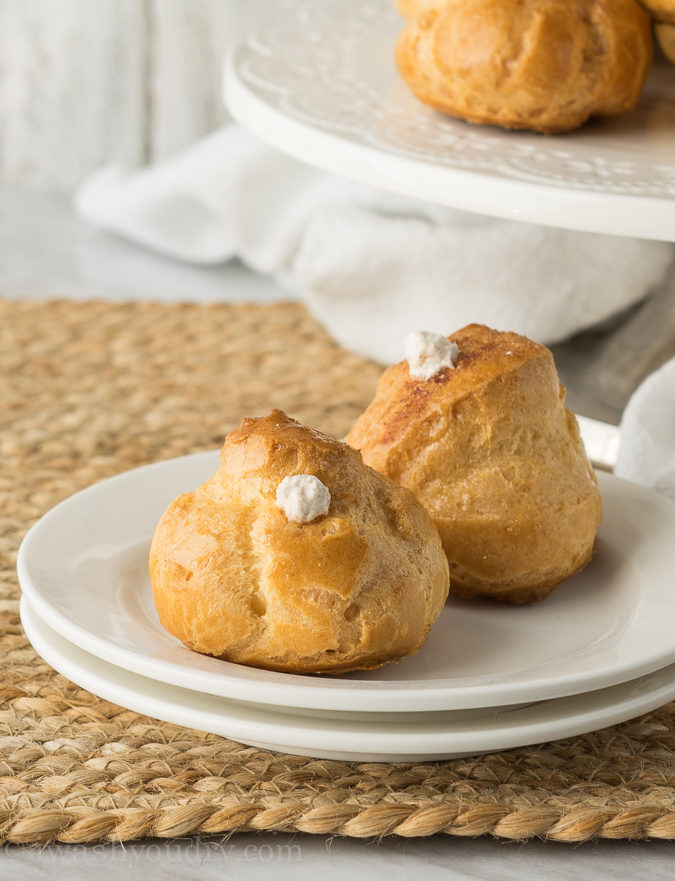 I never knew making homemade cream puffs was so easy! These Churro Cream Puffs are brushed with honey and dusted with cinnamon and sugar. The filling is a delightful cinnamon flavored whipped cream! 