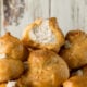 I never knew making homemade cream puffs was so easy! These Churro Cream Puffs are brushed with honey and dusted with cinnamon and sugar. The filling is a delightful cinnamon flavored whipped cream!