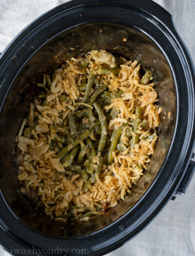 This Crock Pot Green Bean Casserole recipe is a perfect side dish for Thanksgiving or Christmas when the oven is full.